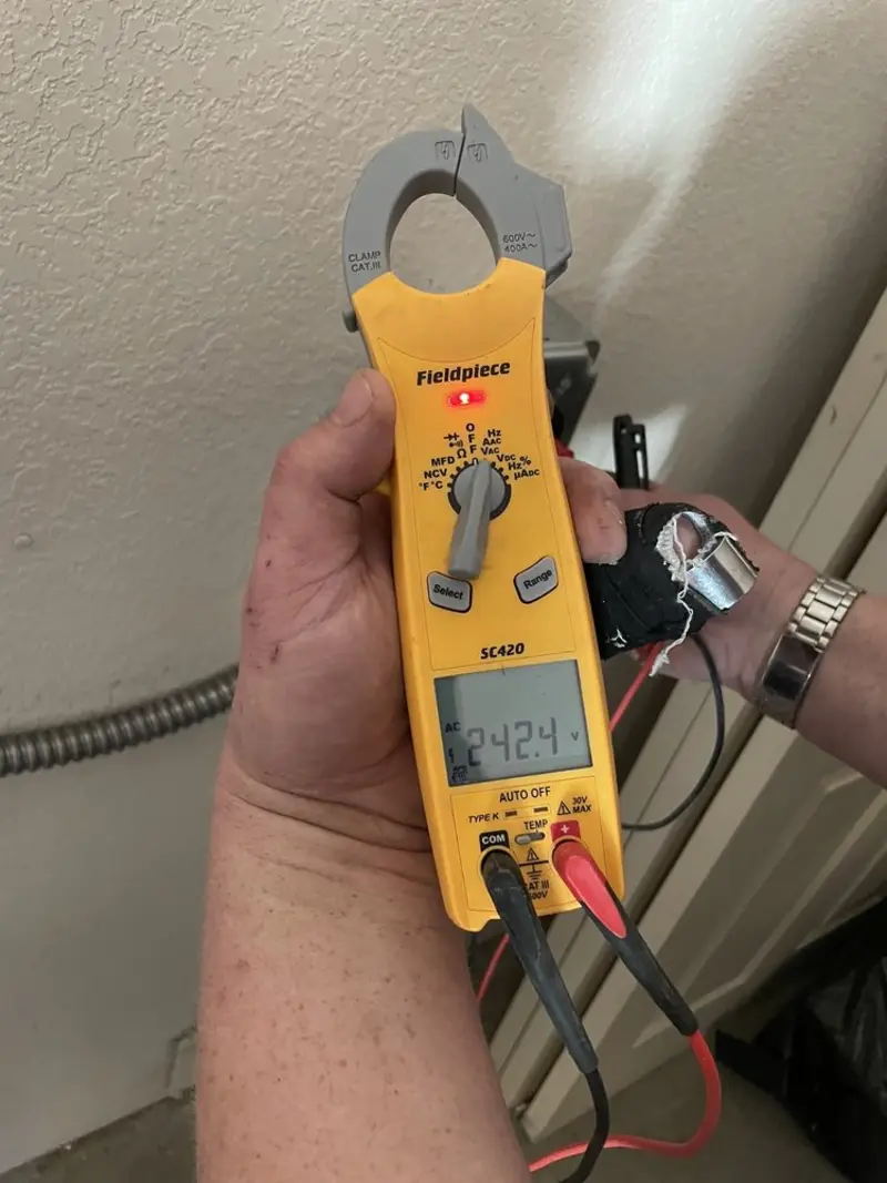 Voltage testing with clamp meter during Electrical Installation Services in Momence